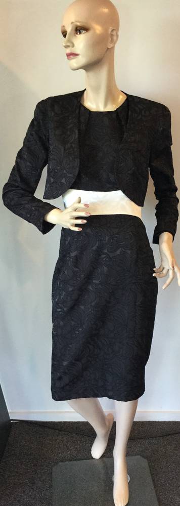 Black dress with a contrasting white waist band - one only size 12