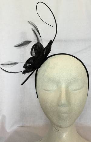 Black flower fascinator with curling stick - one only